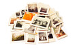 © Yaroslav - Pile of old photos isolated on white background. Retro style. Generative AI.