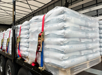 Wall Mural - loading, transportation and unloading of bulk materials in bags of 25 kilograms in a semi-trailer. s