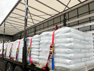 Wall Mural - loading, transportation and unloading of bulk materials in bags of 25 kilograms in a semi-trailer. s