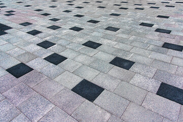 Wall Mural - The texture of a tiled pavement with perspective.