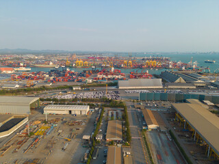 Wall Mural - Aerial view of container cargo ship in the export and import business and logistics international goods in urban city. Shipping to the harbour by crane in Bangkok harbour, Thailand.