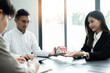 © Natee Meepian - Real estate agent talked about the terms of the home purchase agreement, Home sales and home insurance concept