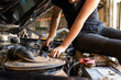© Austockphoto - young australian tradesperson mechanic fixing car engine in automotive repair garage
