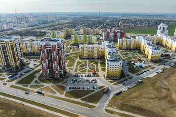 aerial panoramic view over construction of new modern residential complex with high-rise buildings in town