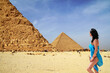 Beautiful woman on vacation at the Great Pyramid in Egypt.