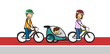 Familie beim Fahrrad fahren mit Kind im Fahrradanhänger
