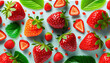 Juicy strawberries and wild strawberries on gray background. Top