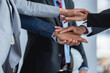 © BESTIMAGE - business teamwork putting join hands together. Unity and teamwork show by Stack mix of hands with Spirit diversity solidarity team Partner. Joins hands together teamwork meetings empower.