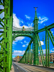 Wall Mural - Budapest, Hungary, February 5, 2023: On Steel Liberty bridge in Budapest. Tram tracks and glimpse of Great Market Hall- largest and oldest indoor market in Budapest