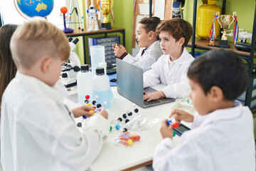 Sticker - Group of kids scientists students using laptop holding molecules at laboratory classroom