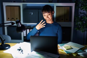 Poster - Young beautiful woman working at the office at night showing and pointing up with fingers number four while smiling confident and happy.