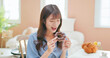 © ryanking999 - asian woman eating donuts happily