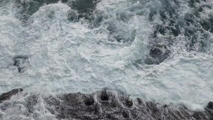 Wall Mural - Water splashes from crashing waves on the coast. Rest on the sea. The power of water and nature