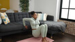 © Krakenimages.com - African american woman training push up at home