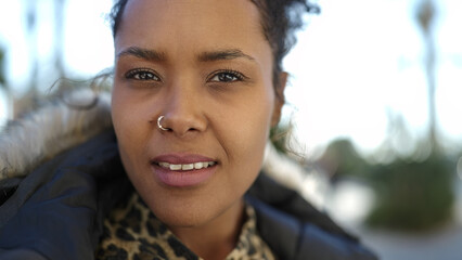 Sticker - African american woman standing with serious expression at street