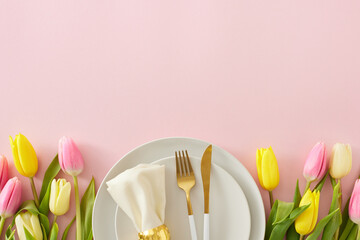 Wall Mural - Mother's Day celebration concept. Top view photo of circle plate cutlery knife fork fabric napkin with ring yellow pink tulips on isolated pastel pink background with empty space