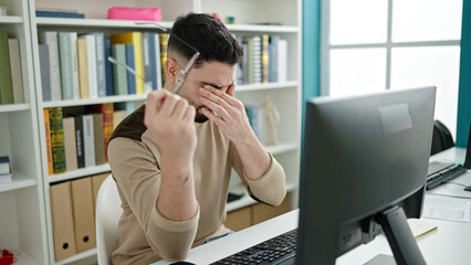 Sticker - Young arab man student tired studying with computer at university classroom