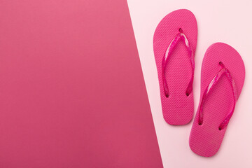 Wall Mural - Bright flip flops on color background, top view