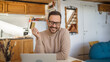 © Miljan Živković - One man caucasian male online shopping use laptop and hold credit card