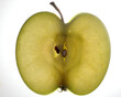 © oqba - Green apple with seed half slice cross section macro closeup backlight on white background