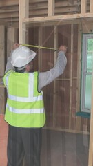 Poster - Animation of statistics processing over male engineer measuring at construction site