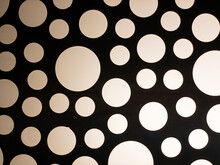 Polka Dot Pattern Of Lights Of Different Sizes On Black Background
