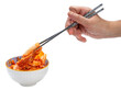 Hand using chopsticks to pick up  Kimchi Or fermented vegetables Korean side dish, Fermented vegetables Korean Traditional food on cup isolate on white PNG File.