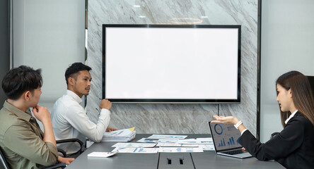 Canvas Print - business people discuss and analyze work, statistics, plans, startup in a meeting room. Teamwork. Presentation