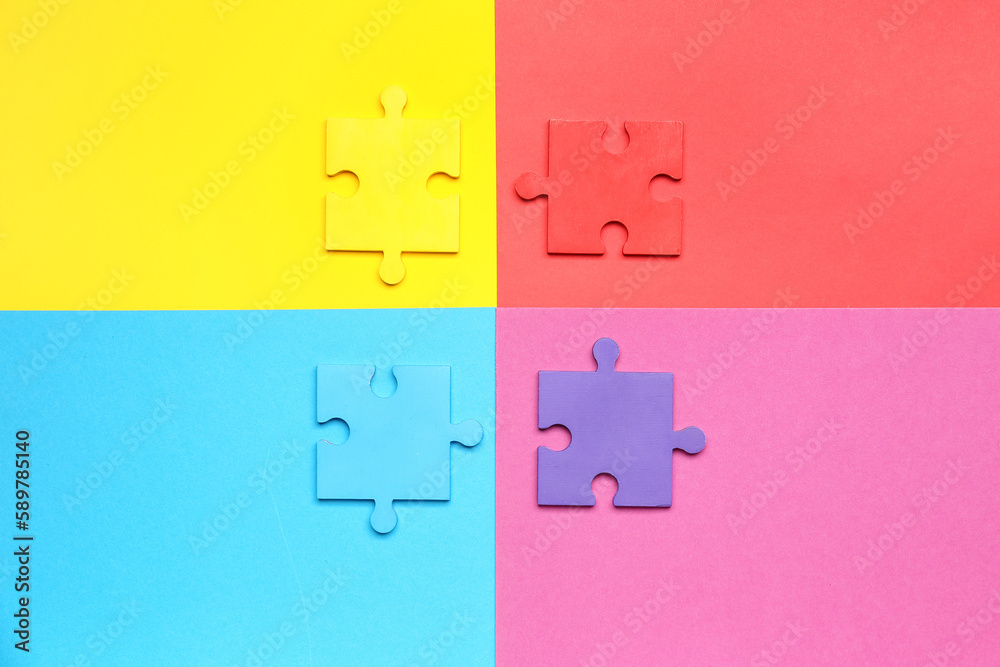 Puzzle pieces on color background. World Autism Awareness Day