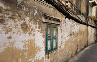 old abandoned house with blue window