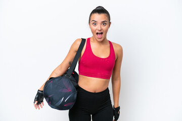 Wall Mural - Young sport woman with sport bag isolated on white background with surprise facial expression