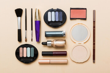 Wall Mural - Professional makeup tools. Top view. Flat lay. Beauty, decorative cosmetics. Makeup brushes set and color eyeshadow palette on table background. Minimalistic style