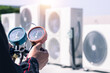 © Nonthanat - air conditioner ,measuring equipment for filling air conditioners.