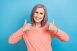 Photo portrait of gorgeous pensioner woman double thumbs up recommendation insurance company advertisement isolated on blue color background