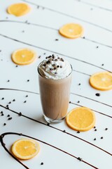 Wall Mural - Vertical shot of a frozen hot chocolate drink on the white background