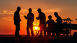 A construction engineer in silhouette, guiding and motivating a worker team during sunrise