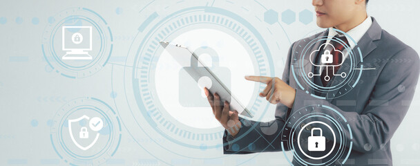 Poster - Business and Technology. Security and Privacy concept. Businessman using digital tablet to locked and protect digital online data.