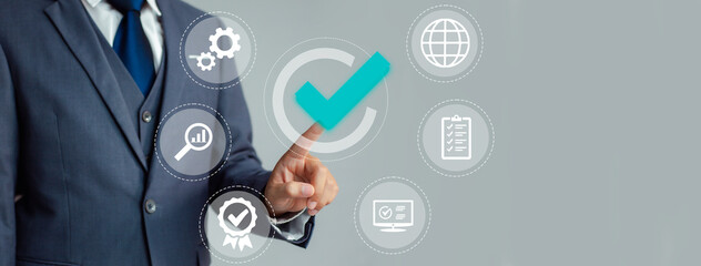 Poster - Businessman working on virtual screen. correct sign tick mark with business icon or online approve paperless and quality assurance concept.