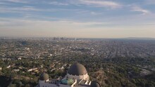 Drone View Of The Griffith Observatory Surrounded By Greenery Under The Sunlight In California
