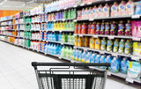 Fototapeta  - empty grocery cart in an empty supermarket.shopping in supermarket.(washing powder,detergent,shampoo, soap)