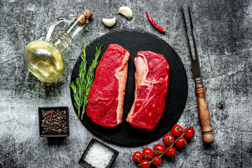 Wall Mural - raw beef steak on stone background