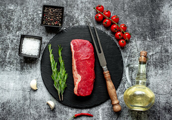 Wall Mural - raw beef steak on stone background