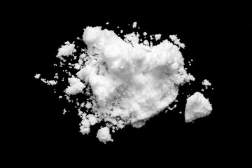 White snow isolated on black background close up