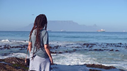 Poster - Woman seen standing and looking at table mountain