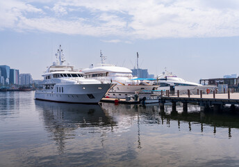 Wall Mural - View across the Creek towards Deira with large boats docked in Dubai, UAE