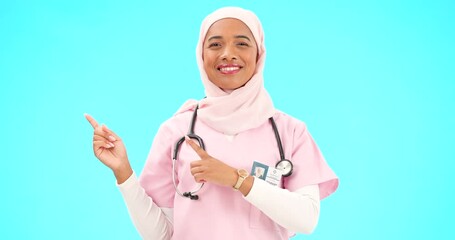 Canvas Print - Woman doctor pointing to mockup isolated on blue background for healthcare presentation or product placement space. Happy face of nurse or medical muslim person show advertising mock up in studio