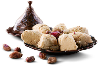 Wall Mural - Bronze plate with date nuts and arabian sweet on the background. Ramadan kareem.