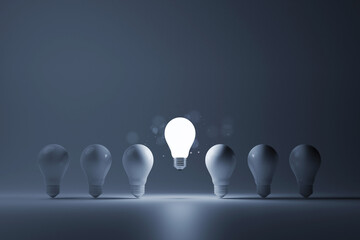 Light bulb bright outstanding among lightbulb on white background. Concept of creative idea and inspire innovation, Think different, Standing out from the crowd. 3d rendering illustration