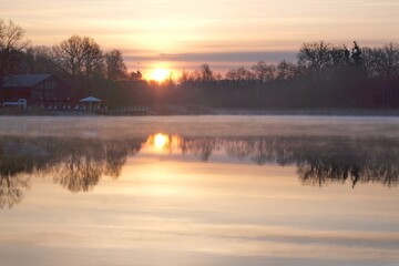 Poster - Beautiful scenery of wooden pier by misty lake in morning light. Otomin Lake, Kashubia, Poland