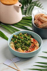 Wall Mural - Portion of hummus bowl with tabbouleh salad and bread